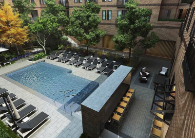567 square foot in-ground, concrete swimming pool in ground level courtyard of Banner Hill Apartment complex.