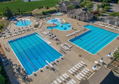 Areal view of 5 inground commercial pool of various sizes.